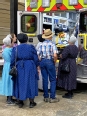 Old Order Mennonite group looking in the back of an ambulance.